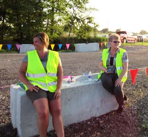 Unified Government Commissioner Melissa Bynum, right, was volunteering with parking on Wednesday night at the Wyandotte County Fair. (Staff photo by Mary Rupert)