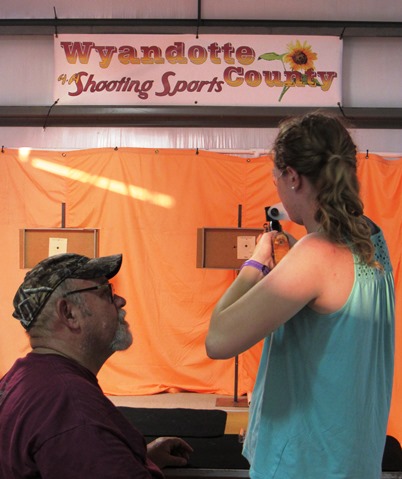 The 4-H shooting sports program held a BB-gun shooting booth inside the red barn at the Wyandotte County Fair on Wednesday. There is also a no gun sign posted at the entrance of the county fair, and guns are not allowed to be brought in. (Staff photo by Mary Rupert)