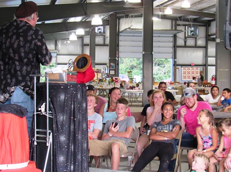 The audience enjoyed a magic show at the red barn on Wednesday at the Wyandotte County Fair. (Staff photo by Mary Rupert)