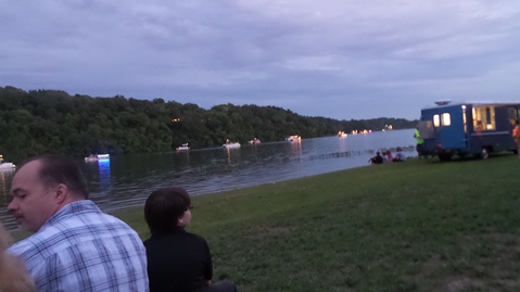 Pontoon boats lit up Wyandotte County Lake on Saturday night. (Photo by Lou Braswell)