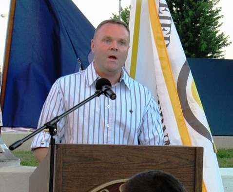 Dustin Dierenfeldt sang "Amazing Grace" at the candlelight vigil for Capt. Robert David Melton held Wednesday night in front of Kansas CIty, Kan., City Hall. (Staff photo by Mary Rupert)