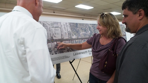 Kim Kooken and Eric Ghafari-Naraghi , owners of Ussery Body Shop, discussed the effects Leavenworth Road modernization may have on their business at 50th and Leavenworth Road at an informational meeting on Monday night. The meeting was held at Davern Hall at Christ the King Church, 53rd and Leavenworth Road.    (Photo by Lou Braswell, Leavenworth Road Association)