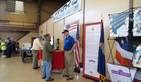 There were several tables and booths with information at the National Night Out Against Crime on Tuesday night at the Kansas National Guard Armory. (Photo by Lou Braswell)