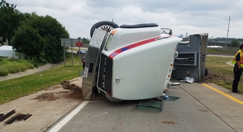 A Mack truck overturned on the I-70 westbound ramp to Central Avenue at 12:43 p.m. Tuesday, Aug. 23, according to a Kansas Turnpike Authority trooper’s report.  The trooper’s report stated the truck exited to Central too fast and overturned. The driver, a 58-year-old man from Olathe, Kan., was injured and taken to a hospital, according to the trooper’s report. (Photo by William Crum)