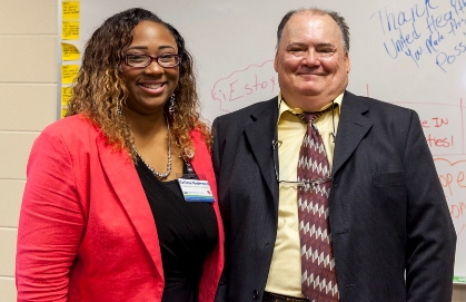 Community health worker Carissa Redmond and her client, Wyandotte County resident Gary Bowley, participated in a community event Aug. 10 at which the Community Health Council of Wyandotte County, in partnership with Kansas City CARE Clinic, was awarded a $1.9 million grant from United Health Foundation to support its recently launched Community Health Worker Collaborative. Redmond has supported Bowley in his journey to better health, encouraging him in a more active lifestyle and helping connect him with the care and resources to address social and health needs. (Photo from CHC and United Health Foundation)