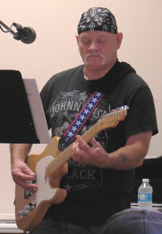 Danny Jones, musician, performed during the Grinter Summerfest on Saturday at 78th and K-32. The free event continues through 4 p.m. Saturday. (Staff photo)