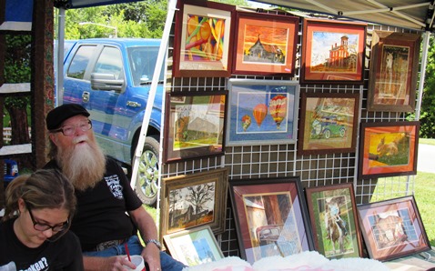 Dwayne Henry of Kansas City, Kan., displayed his art at the annual Grinter Summerfest Saturday at Grinter Place, 78th and K-32 in Kansas City, Kan. The free event continues until 4 p.m. Saturday.  (Staff photo)