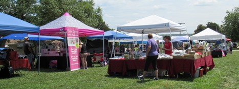 Several tables were in the crafters' area at the Grinter Summerfest Saturday at Grinter Place, 78th and K-32. The free event continues until 4 p.m. Saturday. (Staff photo)