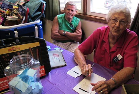 Donna Ready, right, volunteered with the Grinter Place Friends during the Grinter Summerfest Saturday at 78th and K-32. The free event continues through 4 p.m. Saturday. (Staff photo)