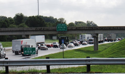 Traffic was backed up on eastbound I-70 near 72nd Street in Kansas City, Kan., on Thursday morning, Aug. 25, because of three crashes on I-70. Heavy rains fell Thursday morning. (Staff photo by Mary Rupert)