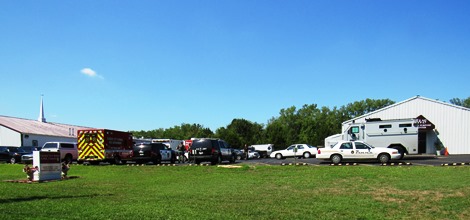 Several different police organizations sent people and vehicles to a staging area on 55th Street south of Parallel Parkway. (Staff photo by  Mary Rupert)