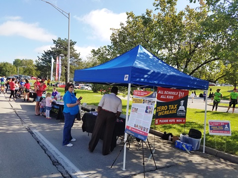 Information booths were at the Library in the Park event today at Big Eleven Lake, 11th and State Avenue. The event, from 10 a.m. to 2 p.m., features free food and entertainment, along with a children’s book giveaway, activities and booths. For more information visit, https://wyandotteonline.com/library-in-the-park-event-saturday-to-feature-newbery-award-winning-book-giveaway-food-entertainment/. (Photo by William Crum)