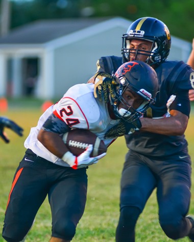 Bonner Springs senior running back Tobias Womack (24) broke a tackle to score his second touchdown of the second quarter. (Photo by Brian Turrel)