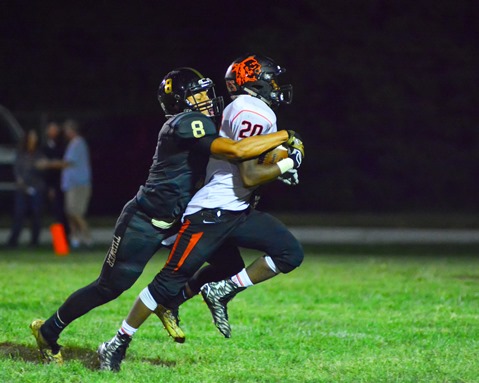 Turner senior wide receiver Jordan Martin (8) made a touchdown-saving tackle on Bonner Springs junior defensive back Alonzo Hokes (20) following Hokes' interception in the third quarter. (Photo by Brian Turrel)