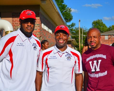 Deandre Tatum, Osmond Fisher, and Christopher Green, of the Wyandotte and Washington high school marching bands, posed together following the completion of a Battle of the Bands between their two schools. (Photo by Brian Turrel)