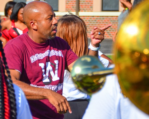 Christopher Green, director of the Washington High School Marching Band, led the band in a song during a Battle of the Bands with Washington High School following the Leavenworth Road Parade. (Photo by Brian Turrel)