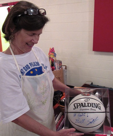 A basketball signed by KU coach Bill Self is one of the items in the Slovenefest silent auction. (Staff photo by Mary Rupert)
