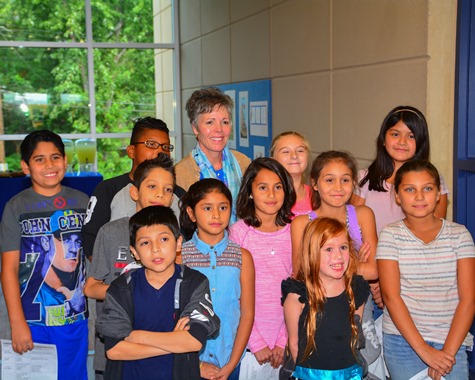 Superintendent Cynthia Lane of the Kansas City, Kan., Public Schools, posed with the Frank Rushton Elementary School Student Council before the dedication of the new school building at 2605 W. 43rd Ave. on Sept. 13. (Photo by Brian Turrel)