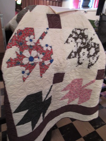 The silent auction at Slovenefest includes a quilt. (Staff photo)