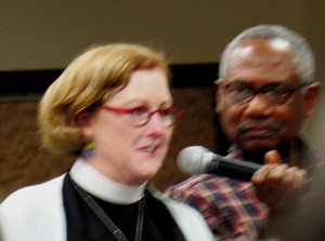 The Rev. Dixie Junk, left, priest in charge at St. Paul's Episcopal Church, at the forum Tuesday invited the community and the police to have a conversation at St. Paul's breakfasts on Saturday morning. (Staff photo by Mary Rupert)