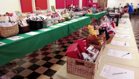 There are tables of items for the silent auction Saturday at the Slovenefest. (Staff photo by Mary Rupert)