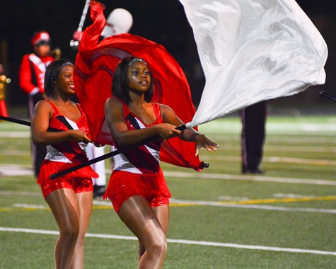 Members of the Wyandotte High School drill team performed with the band during halftime of the football game with Atchison High School on Sept. 23. (Photo by Brian Turrel) 