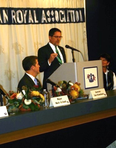 Kansas City, Kan., Mayor Mark Holland, at the podium, and Gov. Sam Brownback, left, spoke at today's announcement that the American Royal plans to move to Wyandotte County. (Photo by Murrel Bland)