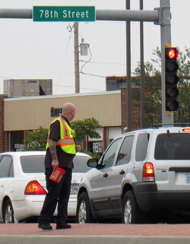 A firefighter today collected funds for police Capt. Robert (Dave) Melton's family, at the intersection of 78th and State Avenue in Kansas City, Kan. Capt. Melton died in the line of duty. Boot block collections are scheduled between 9 a.m. and 4 p.m., Friday, Saturday and Sunday at various intersections in Kansas City, Kan. The boot block collection was by the Kansas City, Kan., Fire Department, in conjunction with the International Association of Firefighters Local 64.