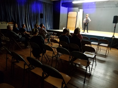 Several persons attended a poetry event Friday night at the Alcott Arts Center, 180 S. 18th St., Kansas City, Kan. (Photo by William Crum)