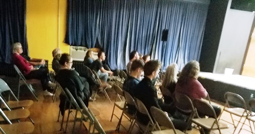 Several persons attended a poetry event on Friday night at the Alcott Arts Center, 180 S. 18th St., Kansas City, Kan. (Photo by William Crum)