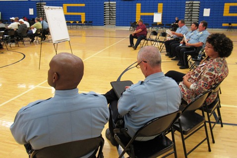 People listened to the mayor speak before the small group discussions started tonight at the community forum on reducing violence. The meeting was at Schlagle High School. (Staff photo by Mary Rupert)