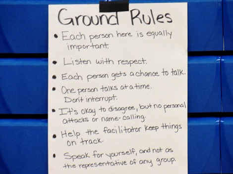 Ground rules were outlined for small group discussions tonight at the community forum on reducing violence. The meeting was at Schlagle High School. (Staff photo)