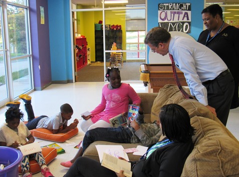 Gov. Sam Brownback talked with students in an independent reading group on Thursday at the Boys and Girls Club. (Staff photo)