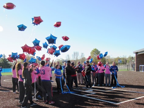 As the ribbon was cut for the new softball field, members of the softball team released balloons. (Staff photo)