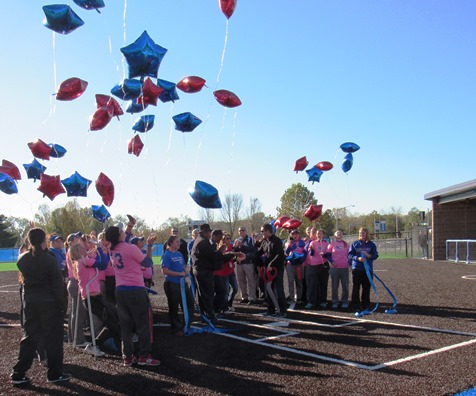 As the ribbon was cut for the new softball field, members of the softball team released balloons. (Staff photo)