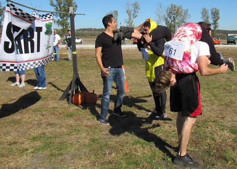 Couples prepared to start the wife-carry event on Saturday at Lakeside Speedway, Kansas City, Kan. (Staff photo)