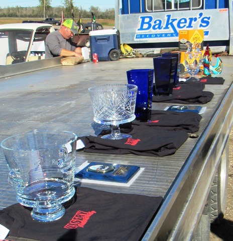 Several trophies were lined up Saturday at a fundraiser for the Reola Grant Center, including trophies for the car show. (Staff photo)