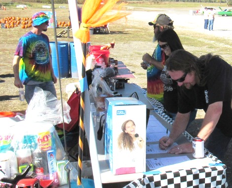 Mike Bergen bid on some silent auction items Saturday at the fundraiser for the Reola Grant Center. (Staff photo)