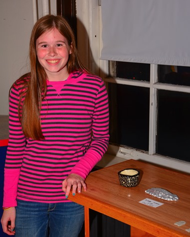 Bishop Ward student Diane Turrel posed next to some of her ceramic pieces at the Bishop Ward Art Show. (Photo by Brian Turrel)