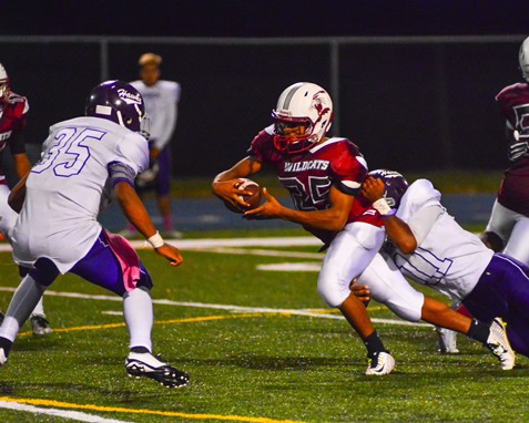 Harmon linebacker Terrance Johnson (11) tackled Washington running back London Williams in the fourth quarter. (Photo by Brian Turrel)