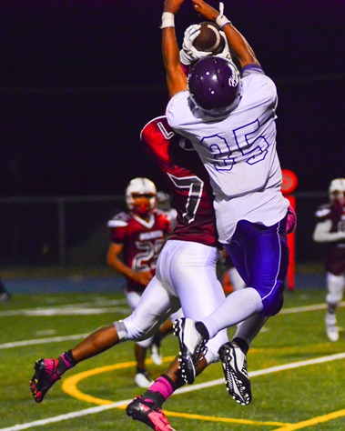 Washington defensive back Larmon Witt III (7) made an interception in front of Harmon receiver Dre'Vontae Tiller to put an end to a late rally by Harmon and seal the 30-10 victory for Washington. (Photo by Brian Turrel) 