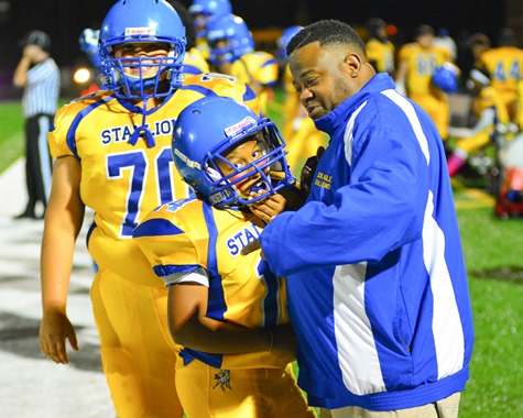 Schlagle freshmen football players Jesus Simental (70) and Jordan Davis (14) enjoyed a light moment on the sidelines during the fourth quarter. (Photo by Brian Turrel)