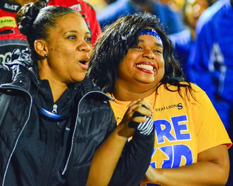 Schlagle Auxiliary member Skyy Freeman, right, flashed a big smile as her name was called during the Senior Night ceremony. (Photo by Brian Turrel)