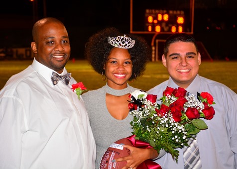Bishop Ward senior Kiandra Hobley posed with her father and senior Michael Ledesma after being crowned as Bishop Ward's homecoming queen. (Photo by Brian Turrel)