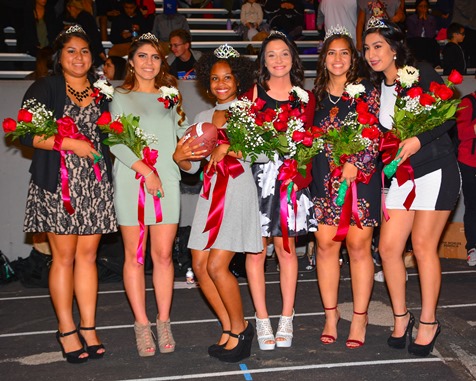Bishop Ward homecoming queen Kiandra Hobley (third from left) posed with the members of the homecoming court at halftime of the football game against Sumner High School on Sept. 30. (Photo by Brian Turrel)