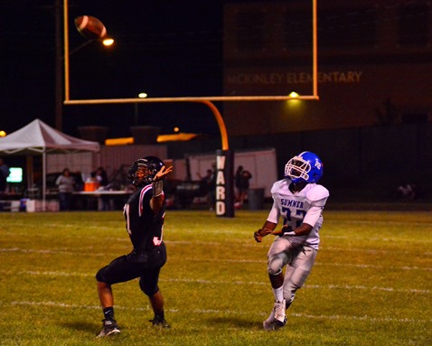 Sumner freshman wide receiver Jerry Ross (22) prepared to catch a pass, which he ran in for a touchdown during the third quarter of the football game against Bishop Ward on Sept. 30. (Photo by Brian Turrel)