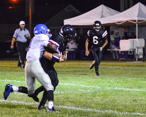 Sumner sophomore wide receiver Donell Bagley attempts to tackle Bishop Ward senior wide receiver Manuel Rodriguez during Rodriguez's runback of an interception. (Photo by Brian Turrel)