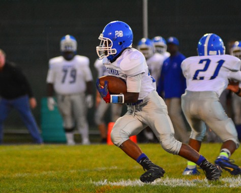 Sumner freshman running back Malachi Moore (28) turned up field on a run in the first quarter of Sumner's football game at Bishop Ward on Sept. 30. (Photo by Brian Turrel)