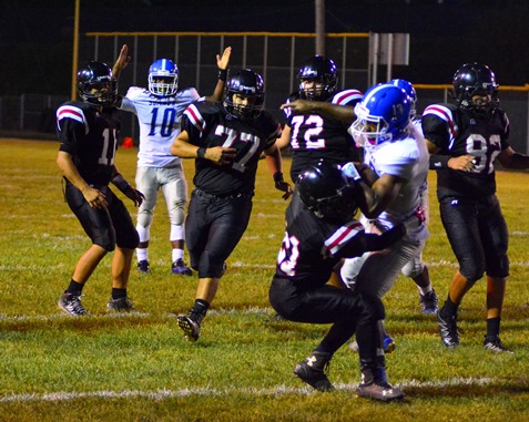 Sumner senior running back Kylen Lindesay (13) surged across the goal line as sophomore quarterback Nahshon Houston (10) signalled a touchdown during the second quarter of the game against Bishop Ward on Sept. 30. (Photo by Brian Turrel)