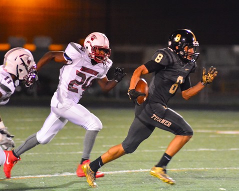 Turner senior wide receiver Jordan Martin (8) was pursued by Washingon defensive end Tiyon Finley (24) after making a reception.  Martin scored a touchdown on the play. (Photo by Brian Turrel)